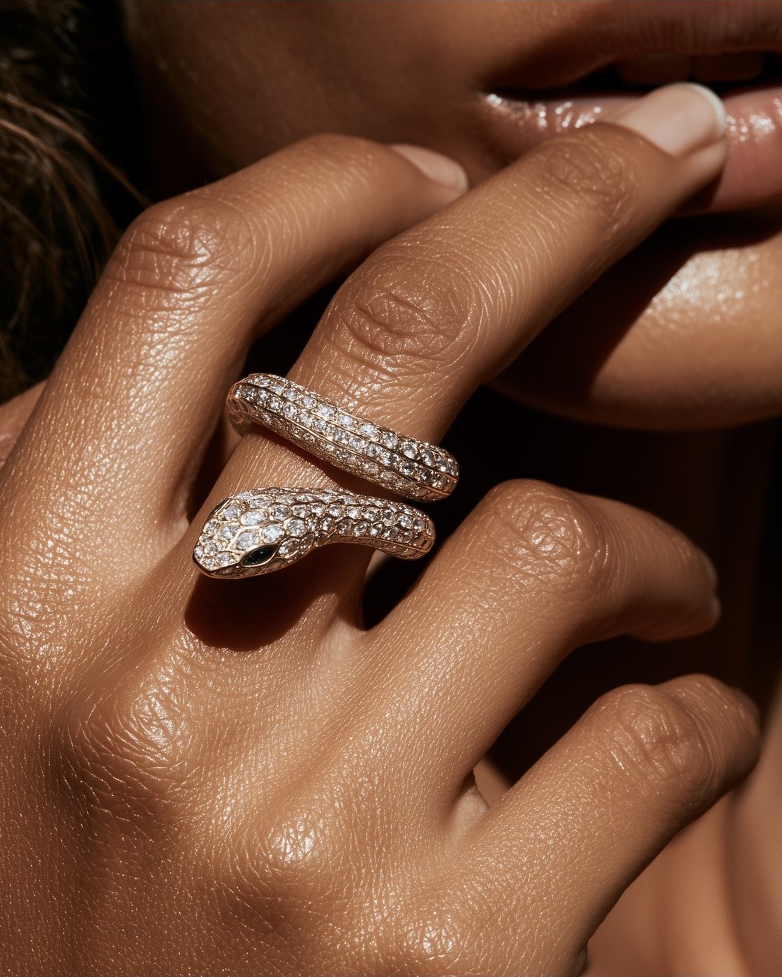 Pavé serpent ring worn on the hand